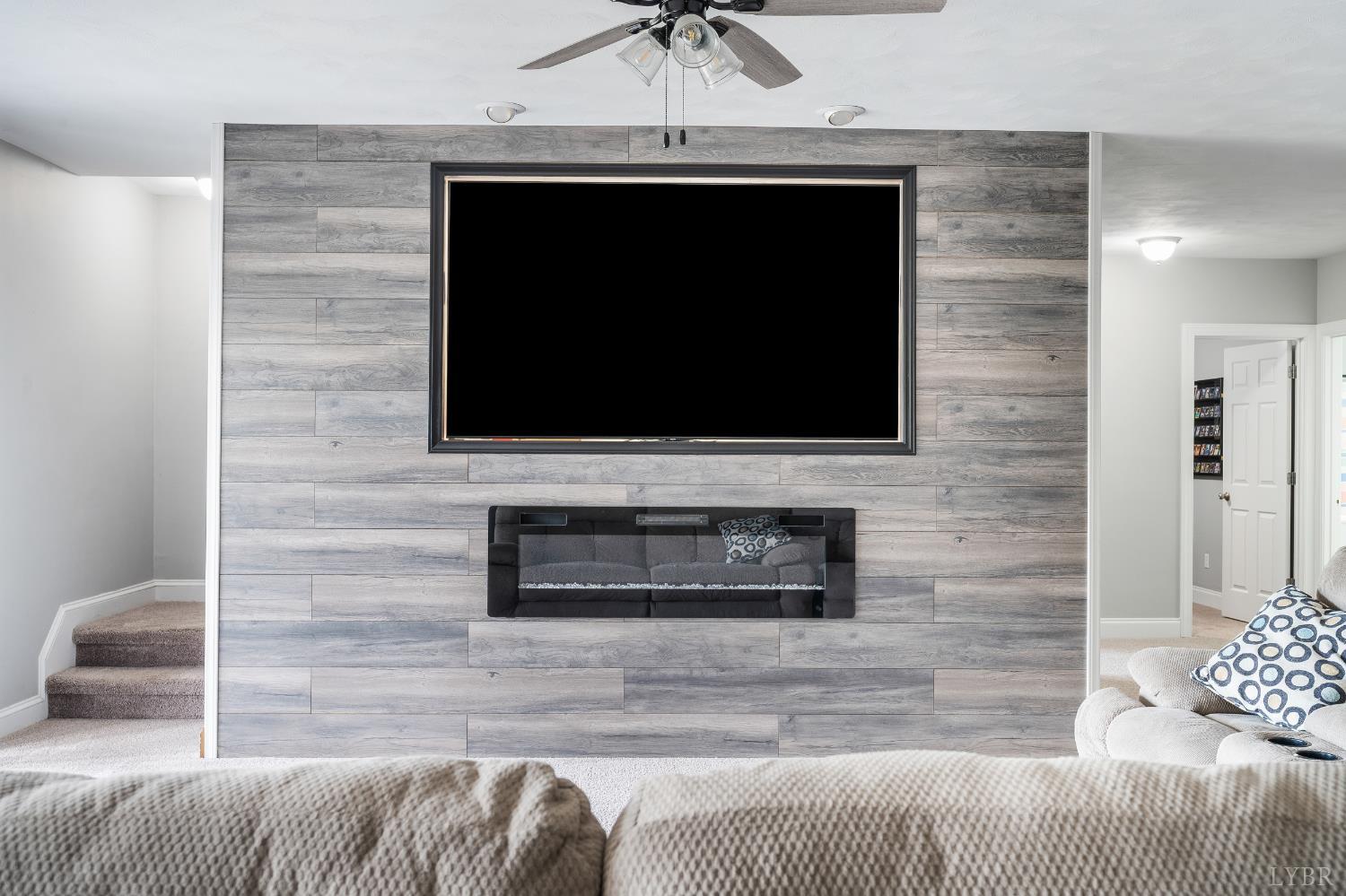 101 Little Creek Road Moneta, VA 24121 - Photo 67 of 76 a living room with a fireplace furniture and a potted plant