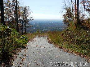 Lot 203 Big Rock Road Bostic, NC 28018 - Photo 2 of 12 a view of a lake with beach