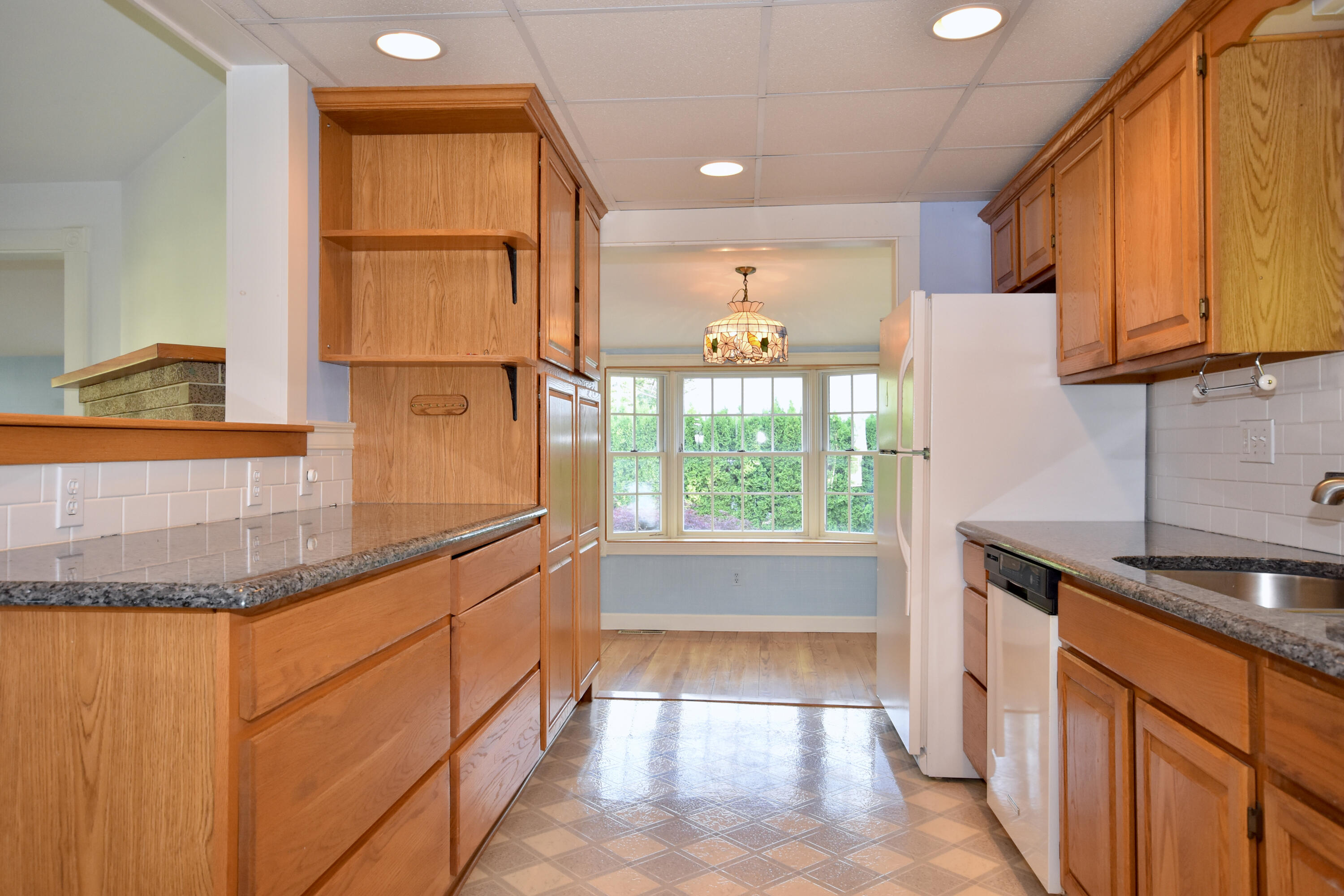 355 Williston Road Sagamore Beach, MA 02562 - Photo 10 of 31 a kitchen with granite countertop a sink and a window