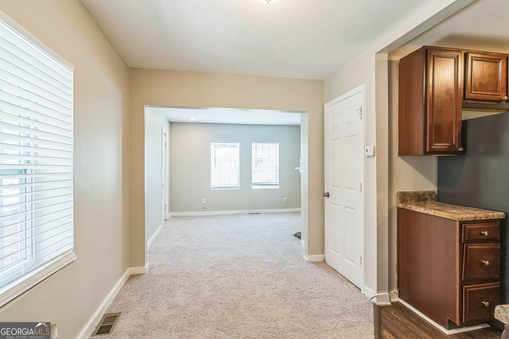 1381 Sharon Street Northwest Atlanta, GA 30314 - Photo 11 of 34 an entryway with a cabinet and a mirror