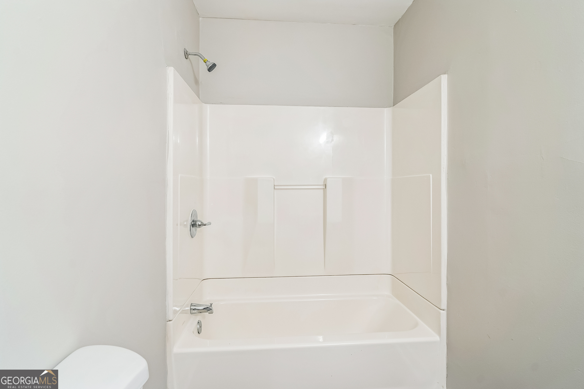 1381 Sharon Street Northwest Atlanta, GA 30314 - Photo 16 of 34 a bathroom with a bathtub shower sink vanity and toilet
