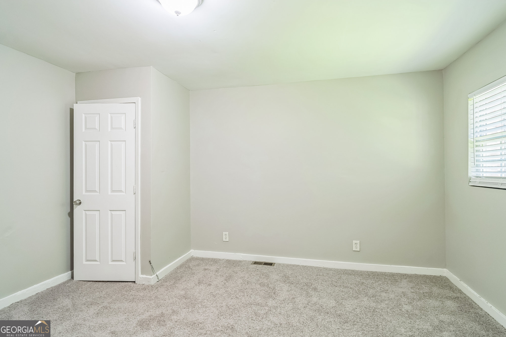 1381 Sharon Street Northwest Atlanta, GA 30314 - Photo 19 of 34 an empty room with windows