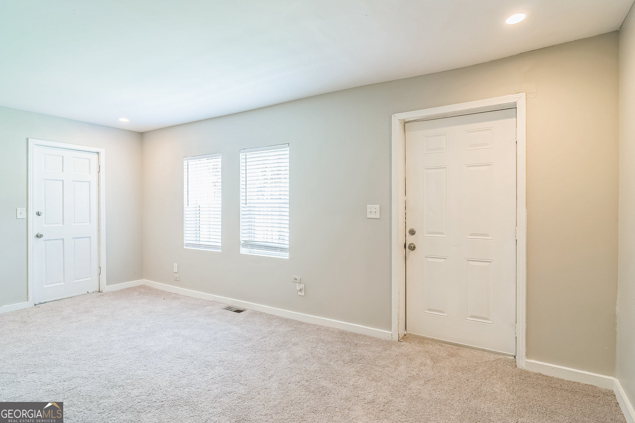1381 Sharon Street Northwest Atlanta, GA 30314 - Photo 27 of 34 an empty room with windows and closet