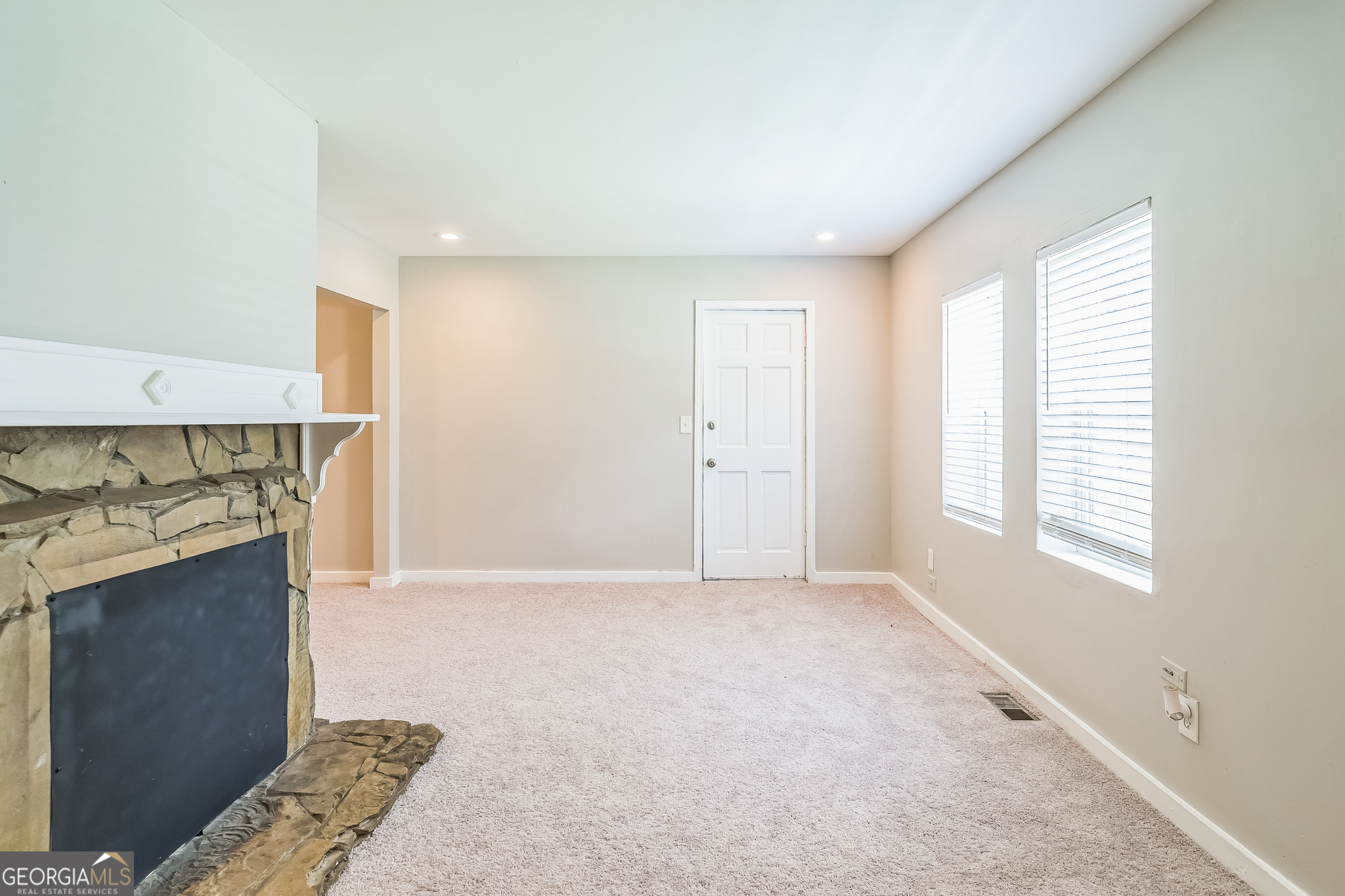 1381 Sharon Street Northwest Atlanta, GA 30314 - Photo 4 of 34 a view of a kitchen with a sink and a fireplace