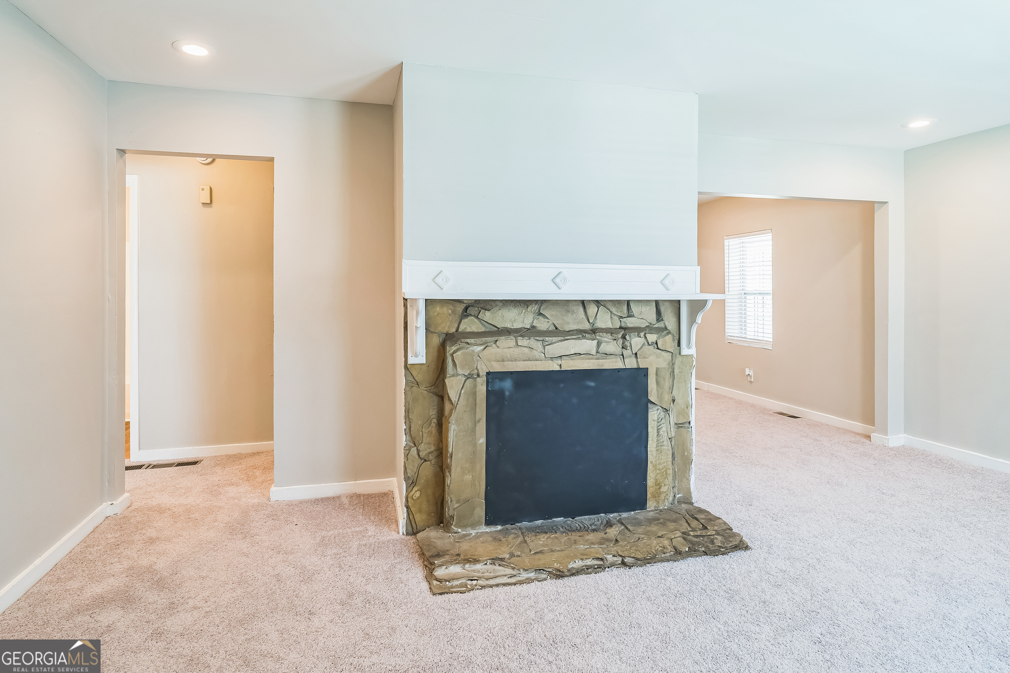1381 Sharon Street Northwest Atlanta, GA 30314 - Photo 6 of 34 an empty room with a fireplace
