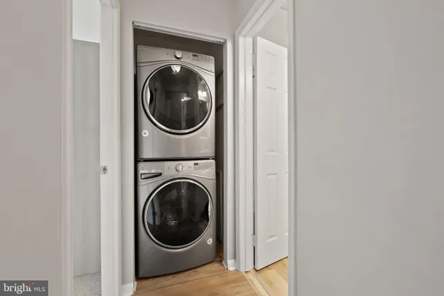 a view of a hallway with washer and dryer