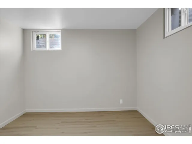 a kitchen with a sink cabinets and a window