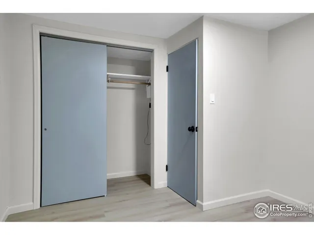 a kitchen with a sink cabinets and chair
