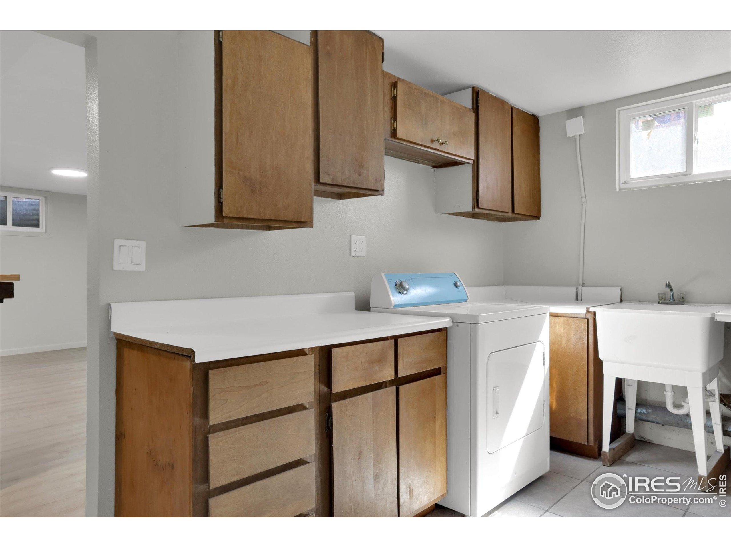 4630 Macky Way Boulder, CO 80305 - Photo 33 of 40 a kitchen with a sink cabinets and a window