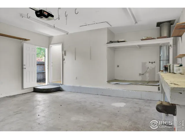 a view of a backyard with wooden fence