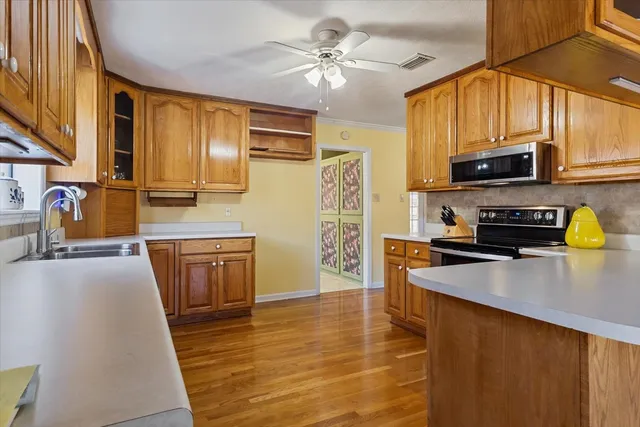 a kitchen with a sink and a window