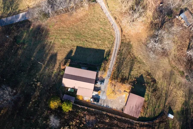 an aerial view of a house with roof deck front of house