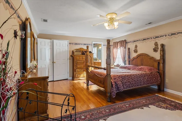 a bedroom with a bed next to a window with outer view