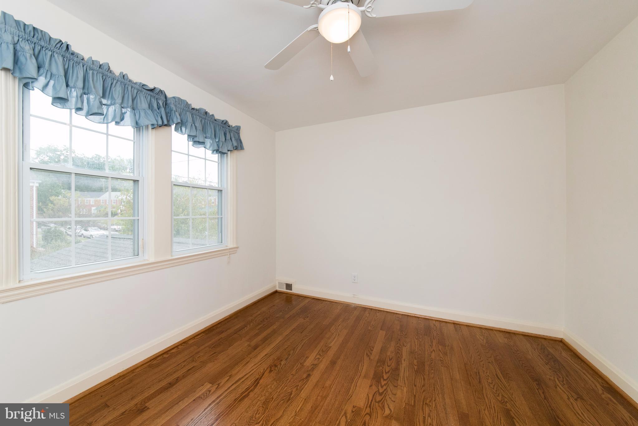 1906 Glen Ridge Road Towson, MD 21286 - Photo 20 of 30 a view of empty room with wooden floor and fan