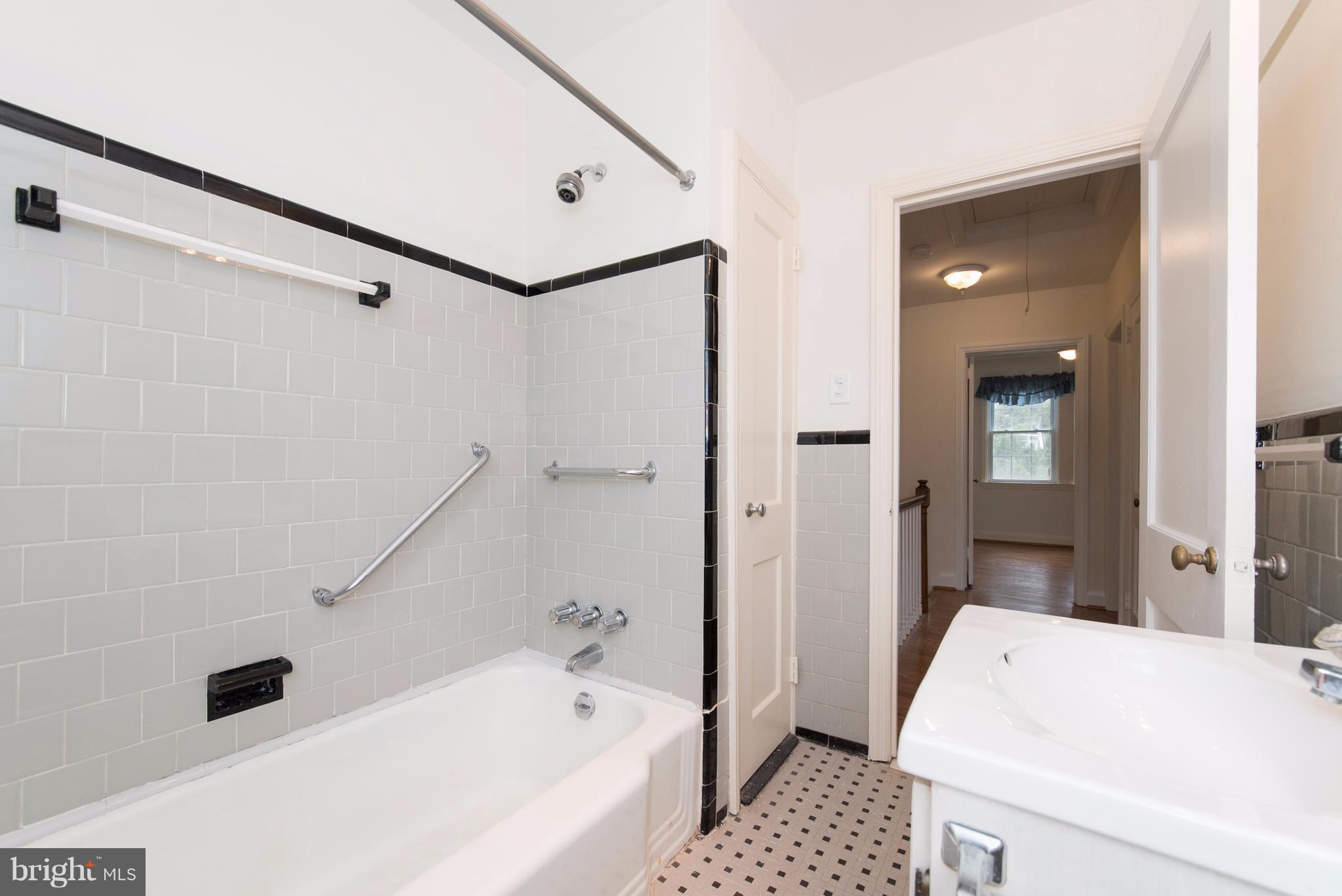 1906 Glen Ridge Road Towson, MD 21286 - Photo 21 of 30 a bathroom with a bathtub and a shower