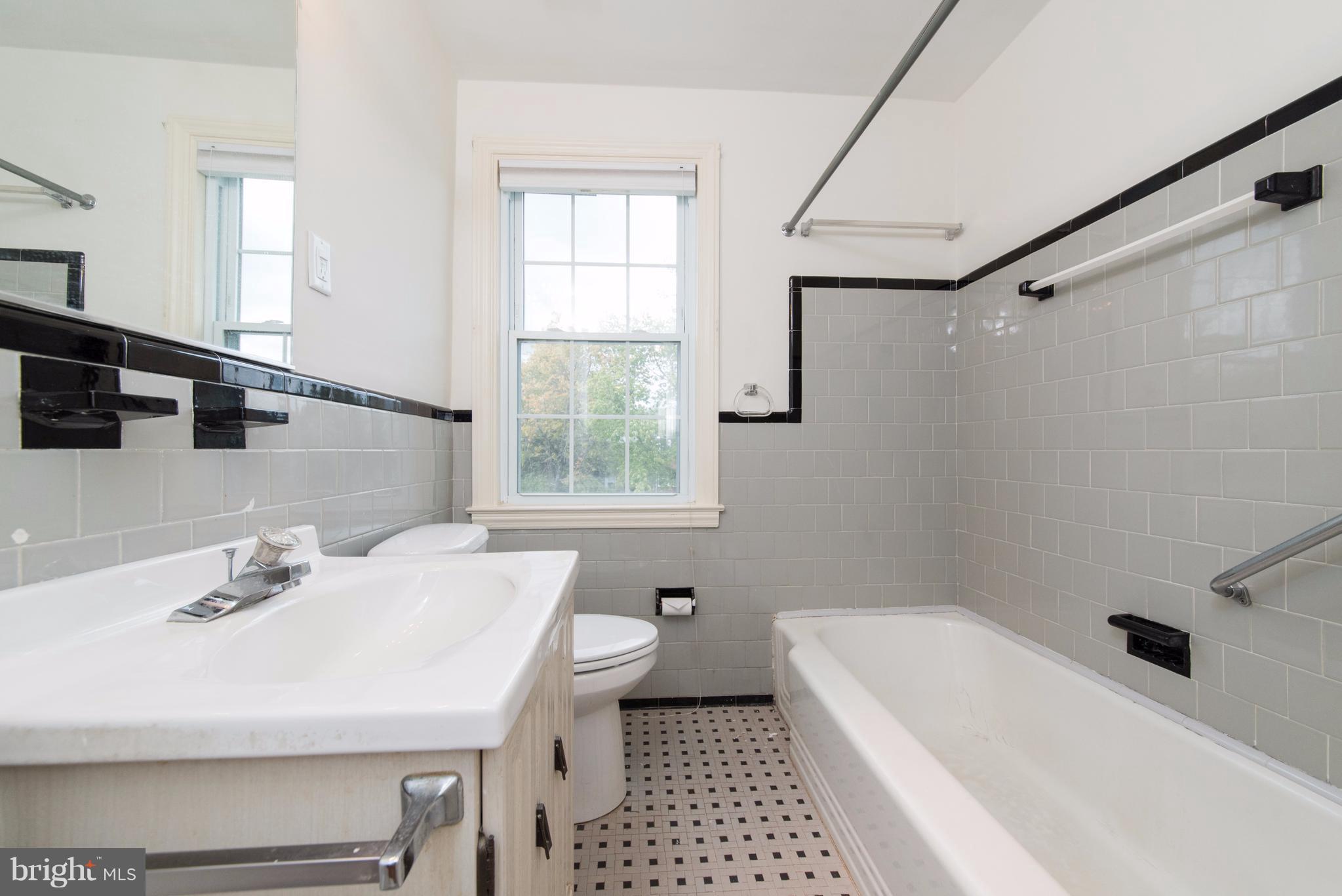 1906 Glen Ridge Road Towson, MD 21286 - Photo 22 of 30 a bathroom with a sink a toilet and shower