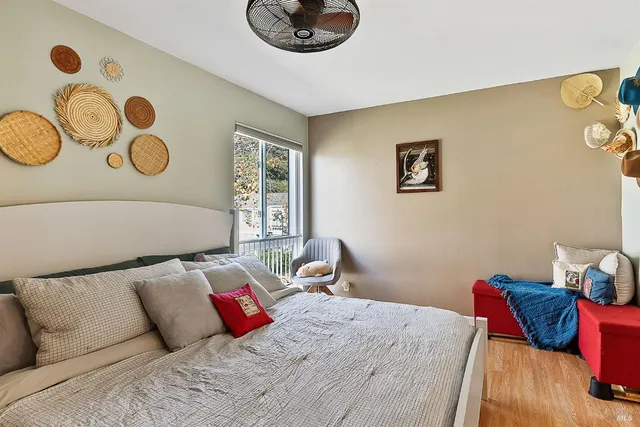 a bedroom with a bed and a window