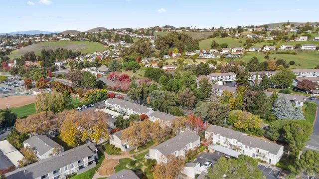 an aerial view of city and mountain