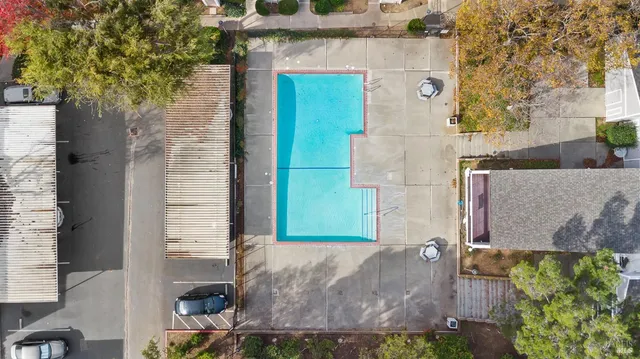 an aerial view of a house with a yard