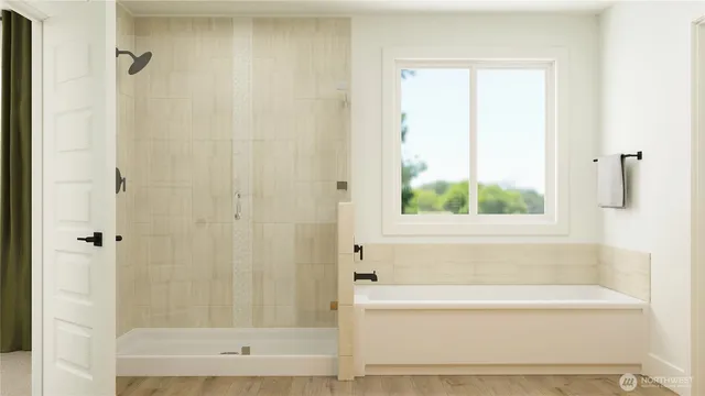 a bathroom with a bathtub and shower
