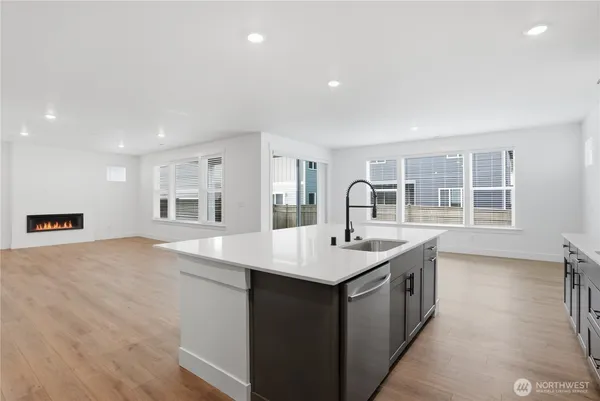 a kitchen with a sink cabinets and window