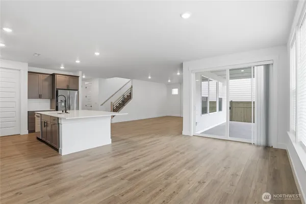a view of kitchen with furniture and wooden floor