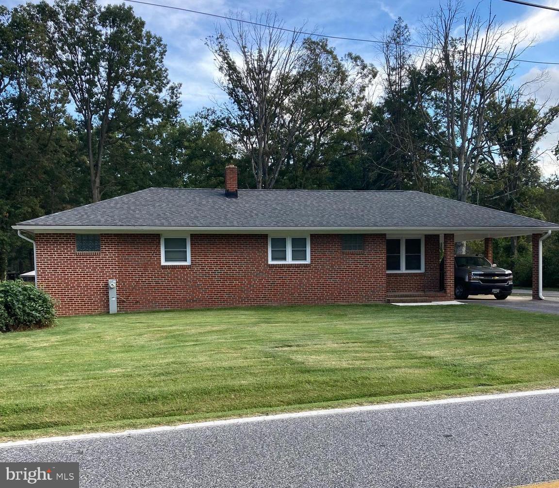 1713 Cape May Road Baltimore, MD 21221 - Photo 2 of 34 a front view of a house with a garden
