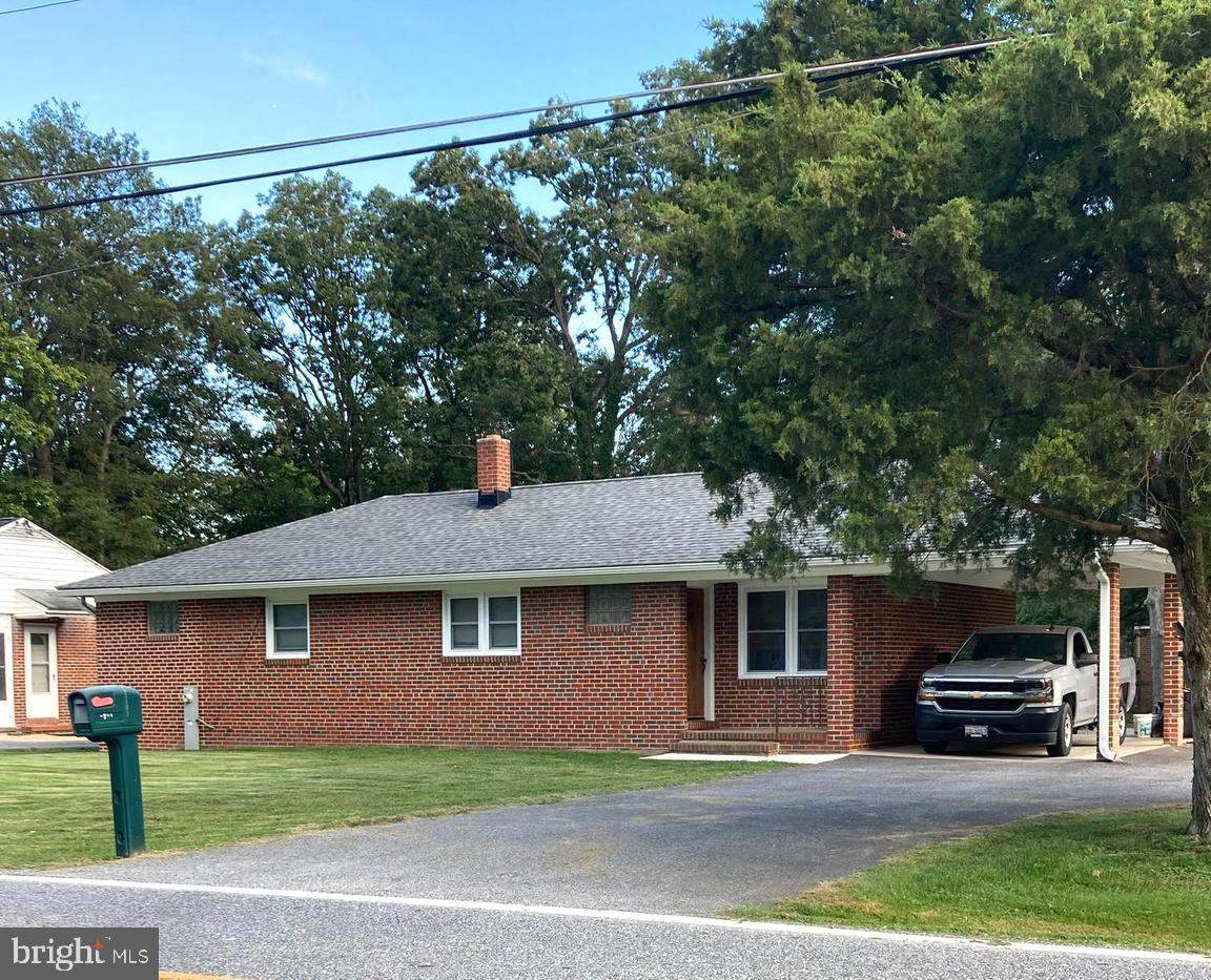 1713 Cape May Road Baltimore, MD 21221 - Photo 3 of 34 a front view of a house with a yard
