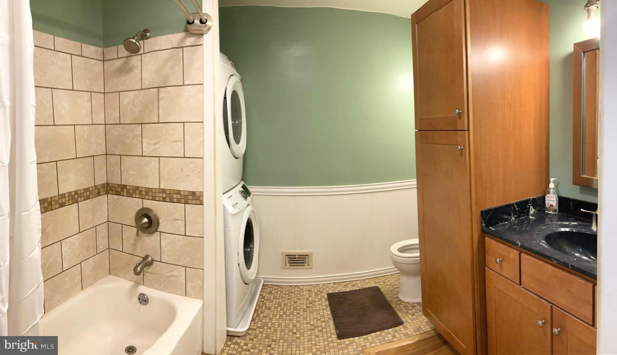1713 Cape May Road Baltimore, MD 21221 - Photo 21 of 34 a bathroom with a sink and a shower