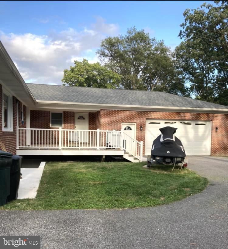 1713 Cape May Road Baltimore, MD 21221 - Photo 26 of 34 a front view of a house with garden