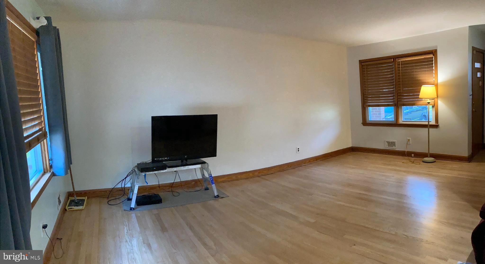1713 Cape May Road Baltimore, MD 21221 - Photo 10 of 34 a view of room with hardwood floor and window