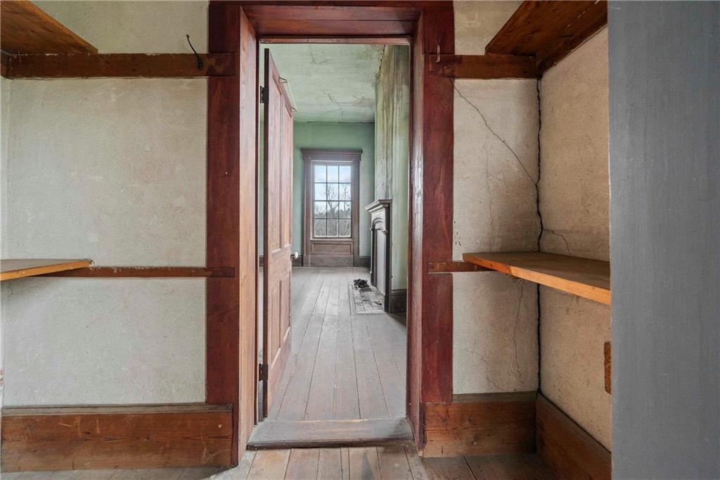 12871 Linton Road Sparta, GA 31087 - Photo 19 of 56 a view of a hallway with wooden floor