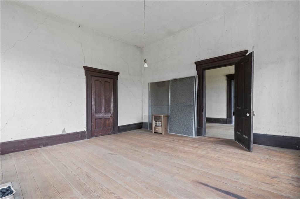12871 Linton Road Sparta, GA 31087 - Photo 24 of 56 a view of empty room with wooden floor