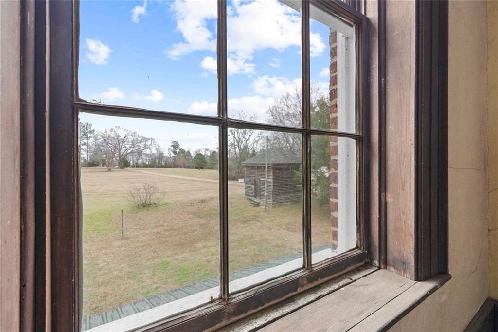12871 Linton Road Sparta, GA 31087 - Photo 27 of 56 a view of a glass door and a window