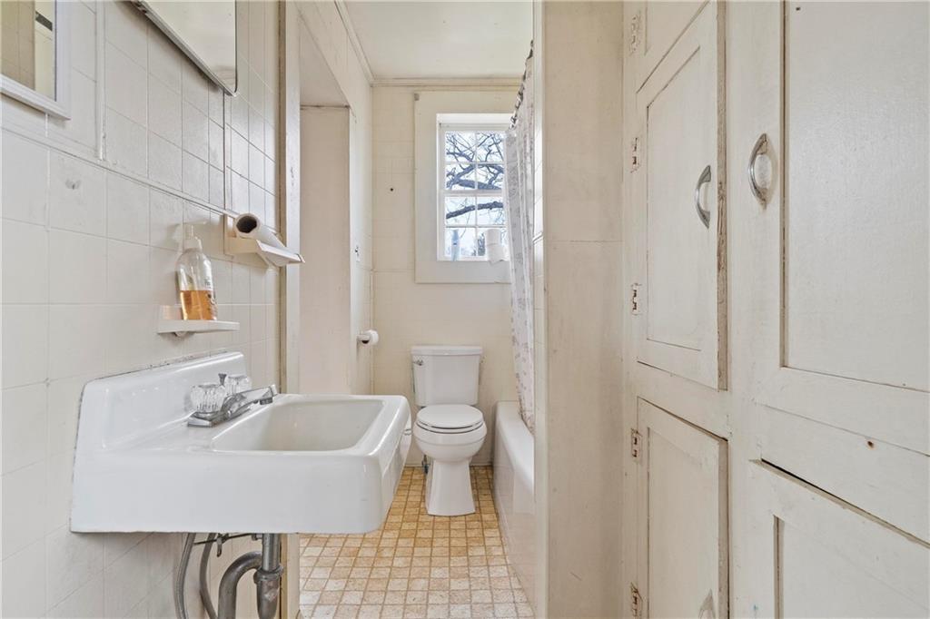12871 Linton Road Sparta, GA 31087 - Photo 36 of 56 a bathroom with a sink toilet and shower