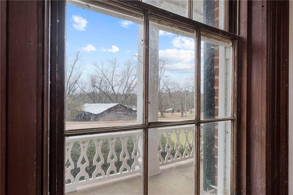 12871 Linton Road Sparta, GA 31087 - Photo 43 of 56 a view of a glass door and windows