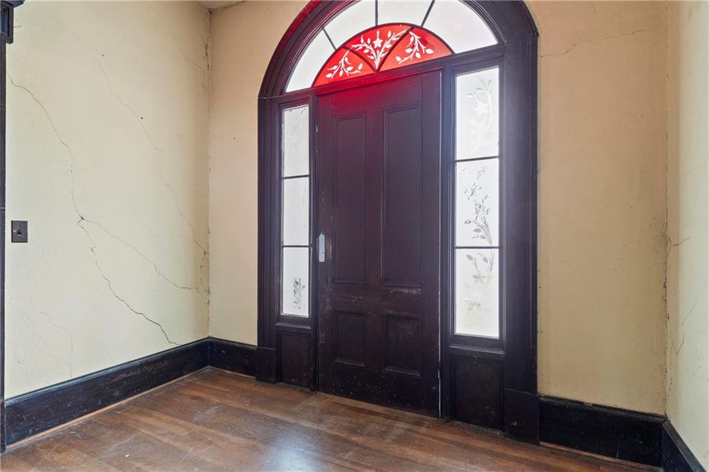 12871 Linton Road Sparta, GA 31087 - Photo 47 of 56 an empty room with wooden floor and window