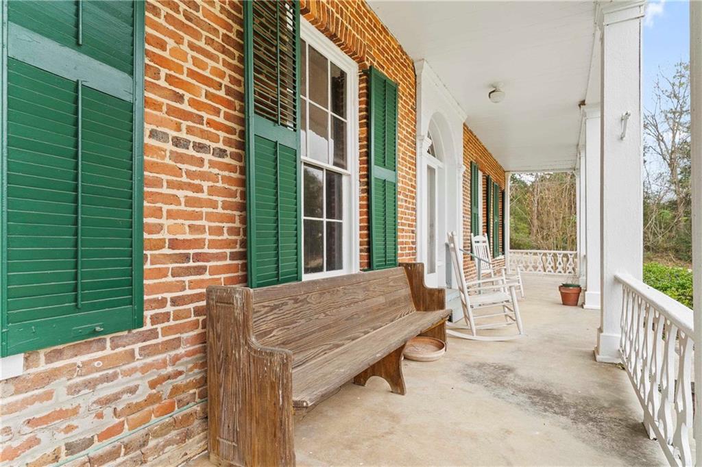 12871 Linton Road Sparta, GA 31087 - Photo 50 of 56 a balcony with furniture and a window