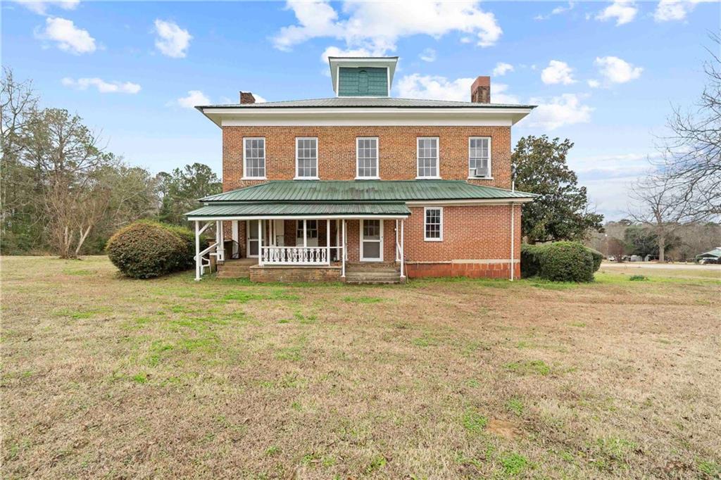 12871 Linton Road Sparta, GA 31087 - Photo 53 of 56 a front view of a house with a garden