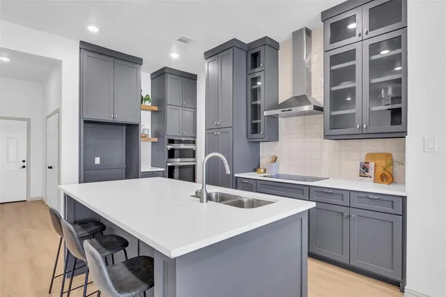a view of kitchen island with furniture and refrigerator