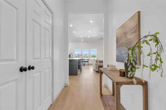 a living room with fireplace furniture and a large window