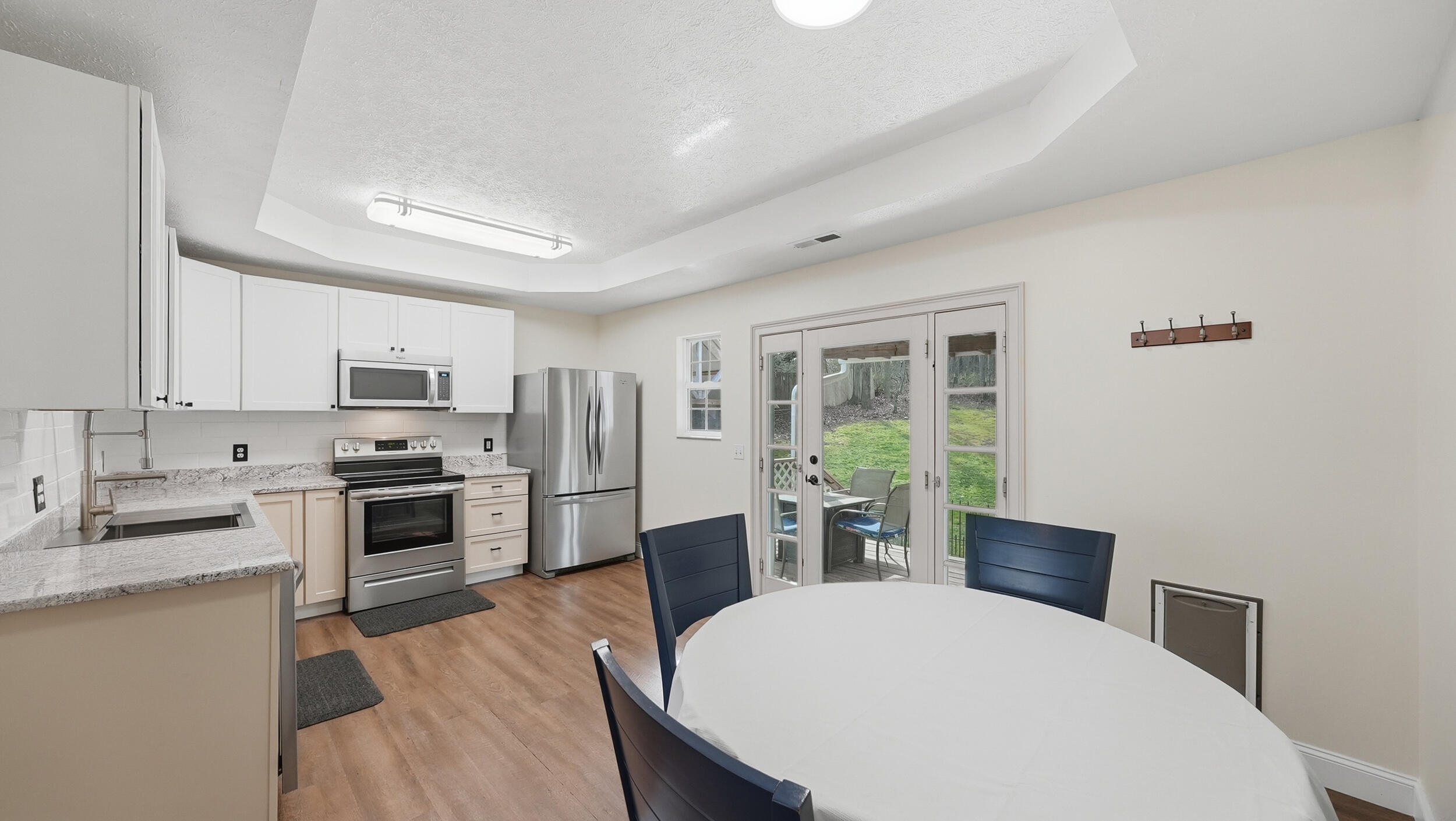 338 Condra Road Ringgold, GA 30736 - Photo 13 of 49 Kitchen and Dining with Tray Ceiling