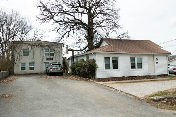 a house with trees in front of it