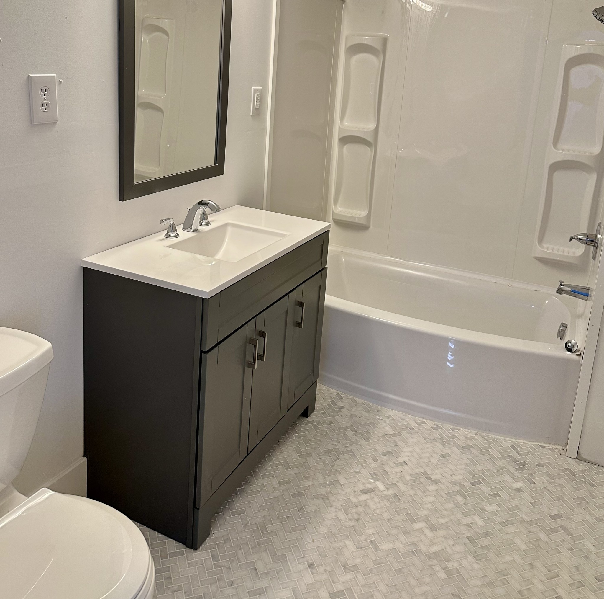 507 Spring Street East Cookeville, TN 38501 - Photo 5 of 15 a bathroom with a sink a toilet and shower