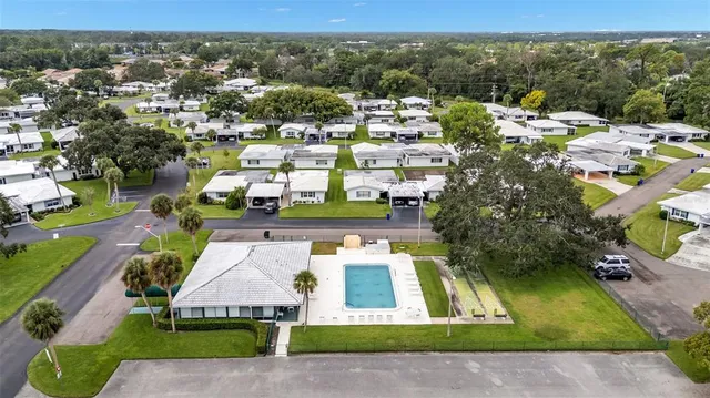an aerial view of a house with a garden