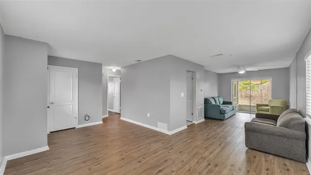 a view of a livingroom with furniture and wooden floor