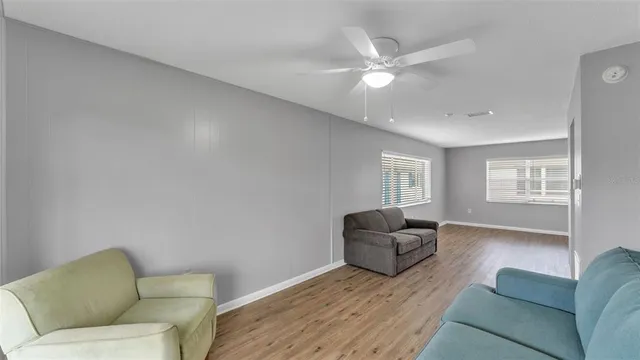 a living room with furniture and a window