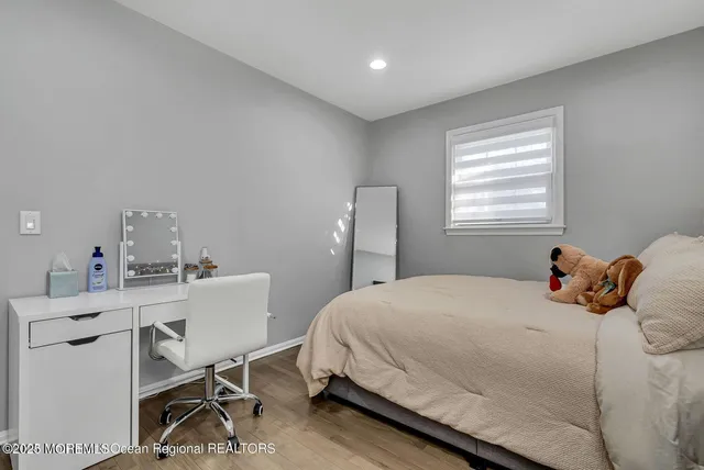 a bedroom with a bed and a table in it