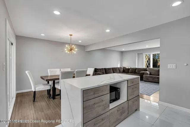 a large kitchen with a table and chairs