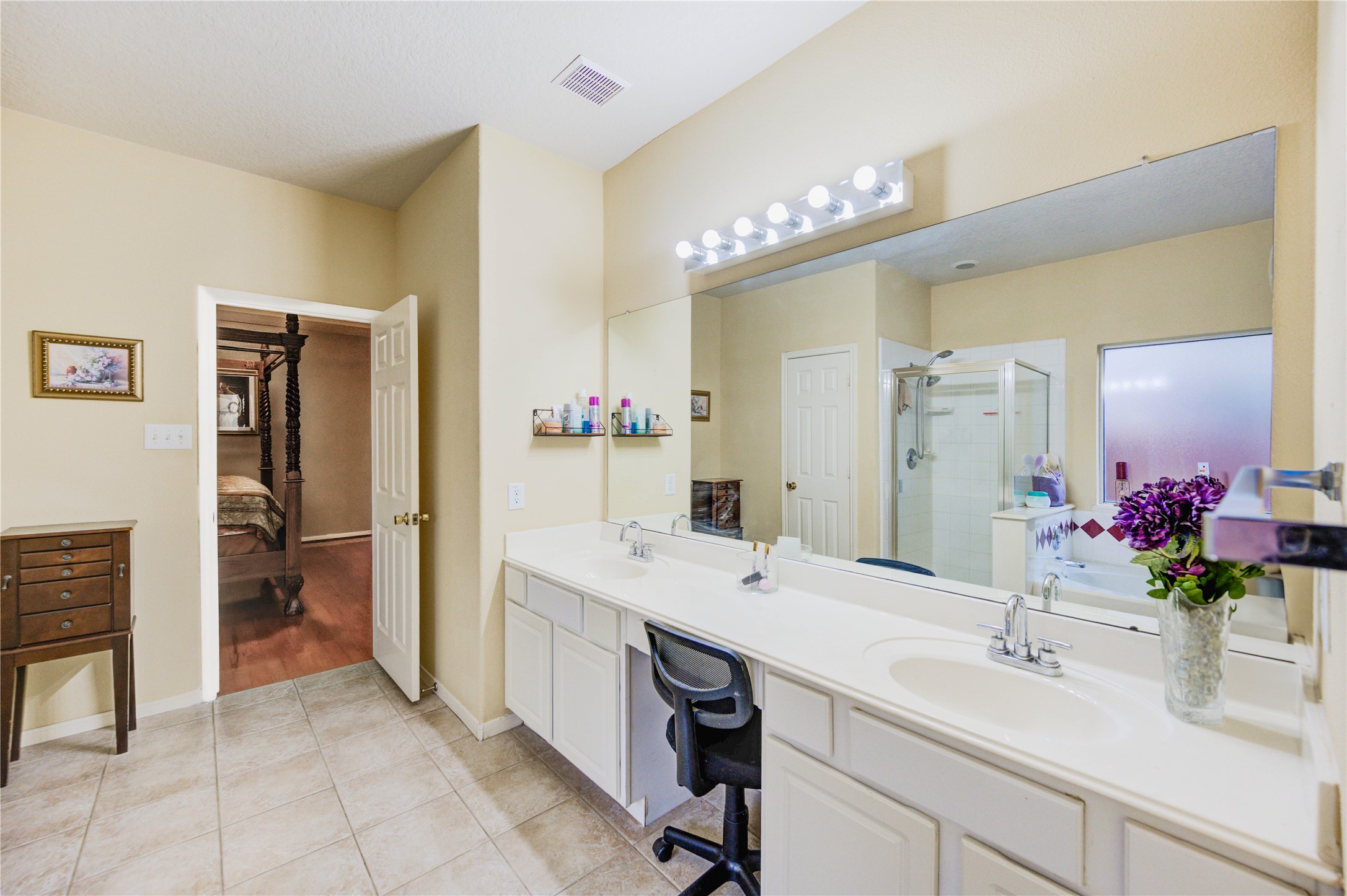 16730 Spring Barker Drive Cypress, TX 77429 - Photo 36 of 50 a bathroom with a sink double vanity and a mirror